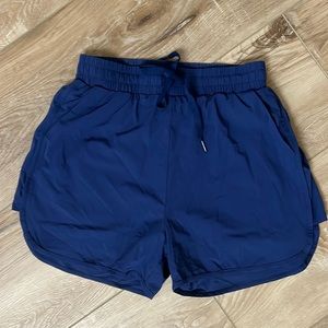 Buff Bunny Midnight blue wind short with attached spanx. Worn once. Size small